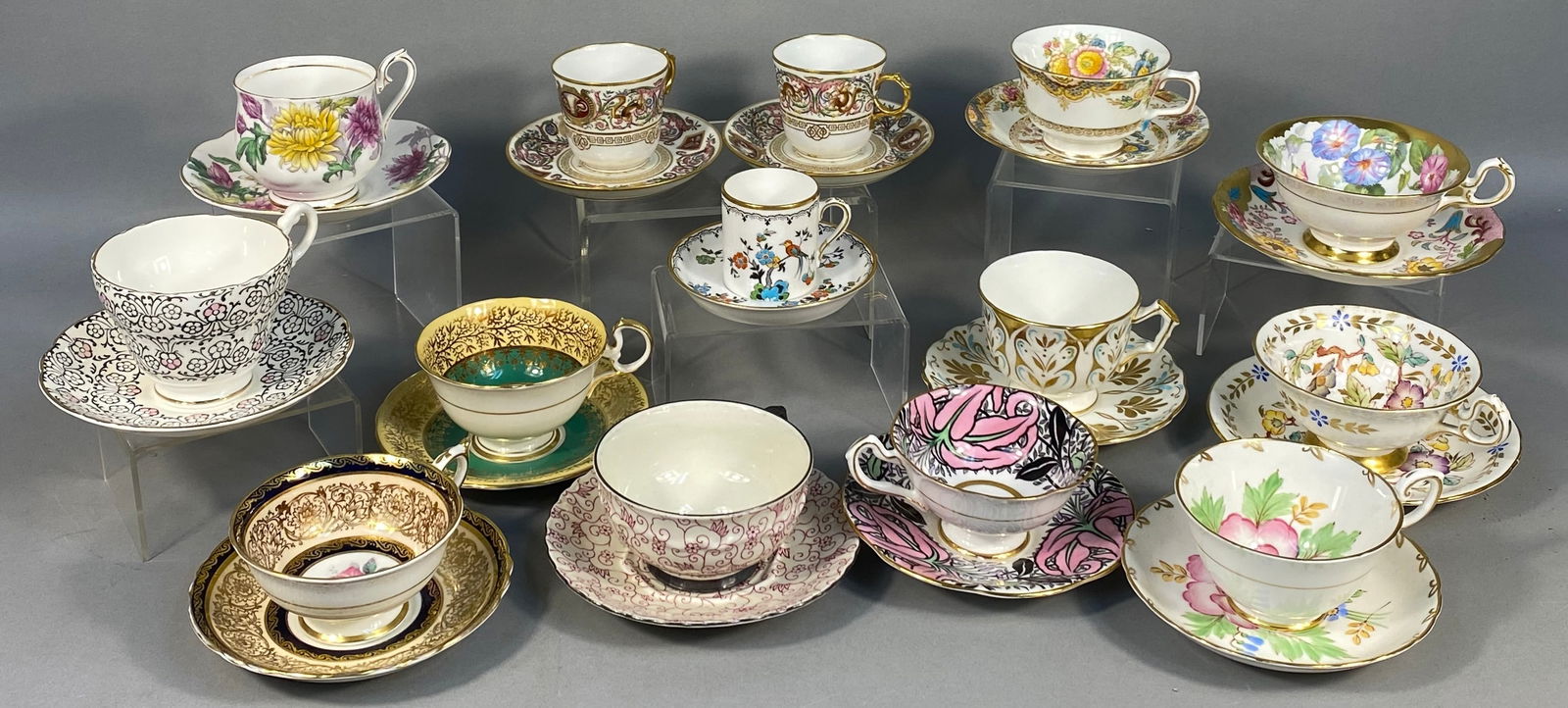 A Collection of Fourteen Antique and Vintage Teacup and Saucer Sets, Predominantly English Bone: This collection comprises fourteen diverse teacup and saucer sets, primarily crafted from fine English bone china, with one notable Mitterteigh Bavaria porcelain set of German origin. Manufacturers re