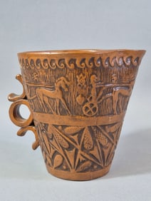 A Greek Figural Terracotta Mug