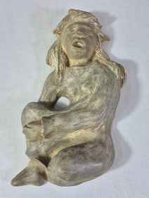 A Weathered Terracotta Relief of a Seated Figure