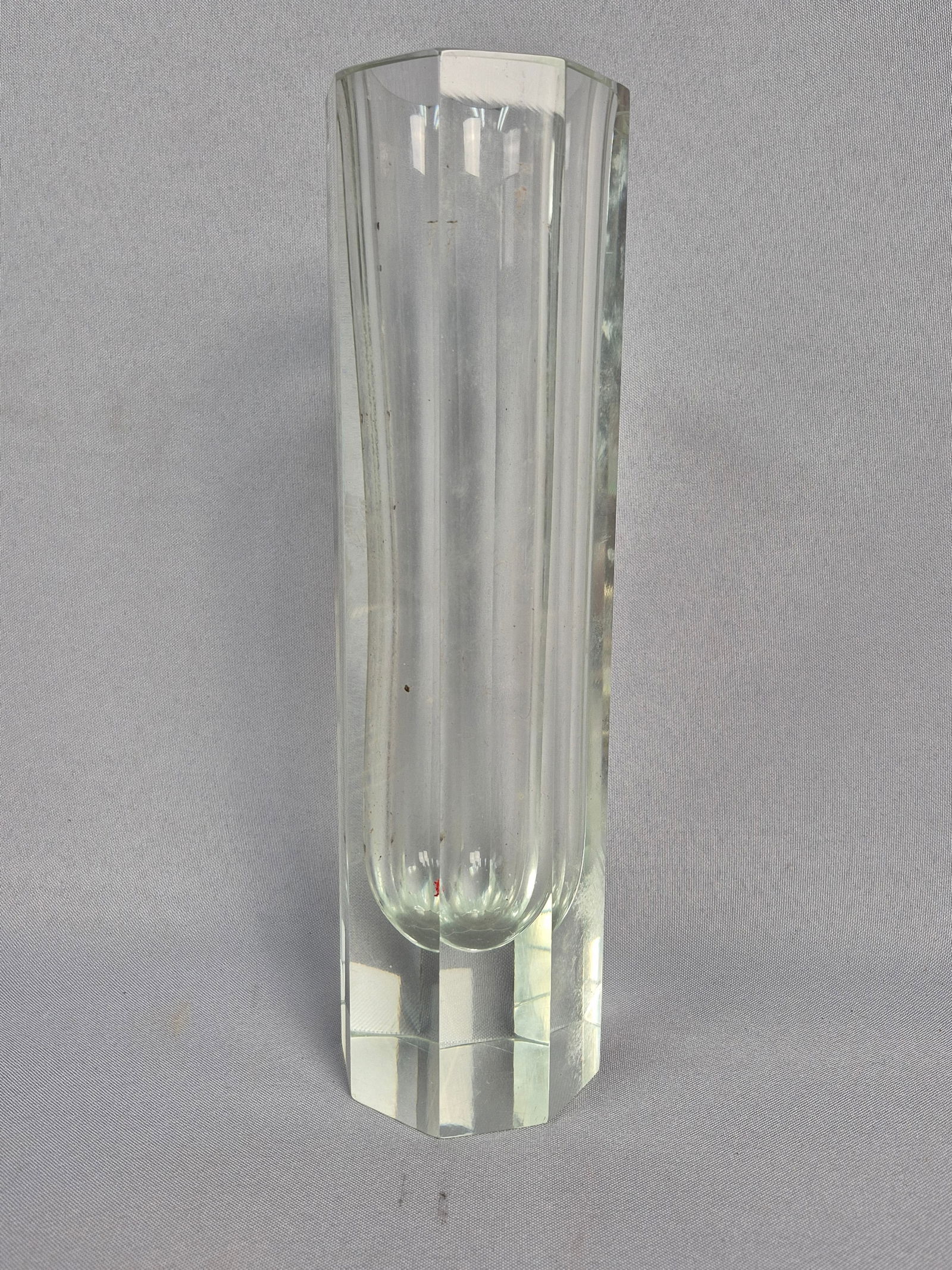 Kosta Boda Bengt Edenfalk 'Colonna' Octagonal Glass Vase: A Kosta Boda 'Colonna' octagonal glass vase, designed by Bengt Edenfalk. This heavy, clear glass vase features a distinct octagonal base and body, tapering slightly towards the top, with pronounced ve
