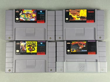 A Group of Four Super Nintendo Entertainment System (SNES) Video Game Cartridges