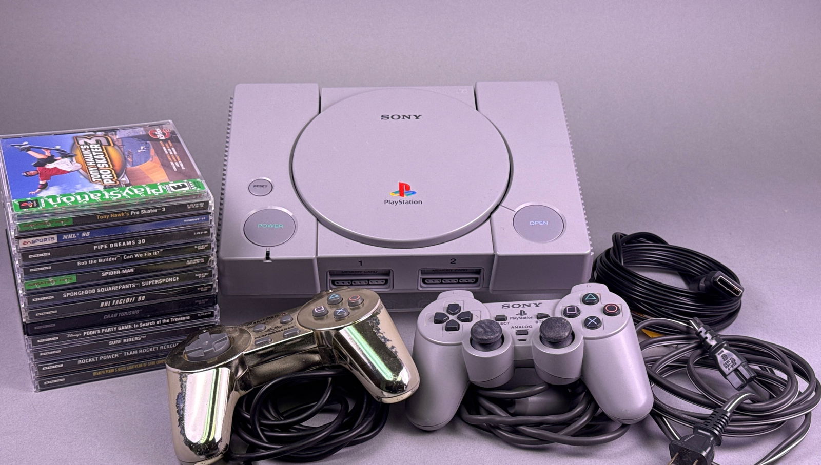 Sony PlayStation 1 Console with Two Controllers and A Group of Games (1 of 8)