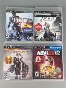 A Group of Four PlayStation 3 Video Games, including God of War Saga, Battlefield 4, Assassin's