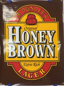 A JW Dundee's Original Honey Brown Extra Rich Lager Advertising Banner