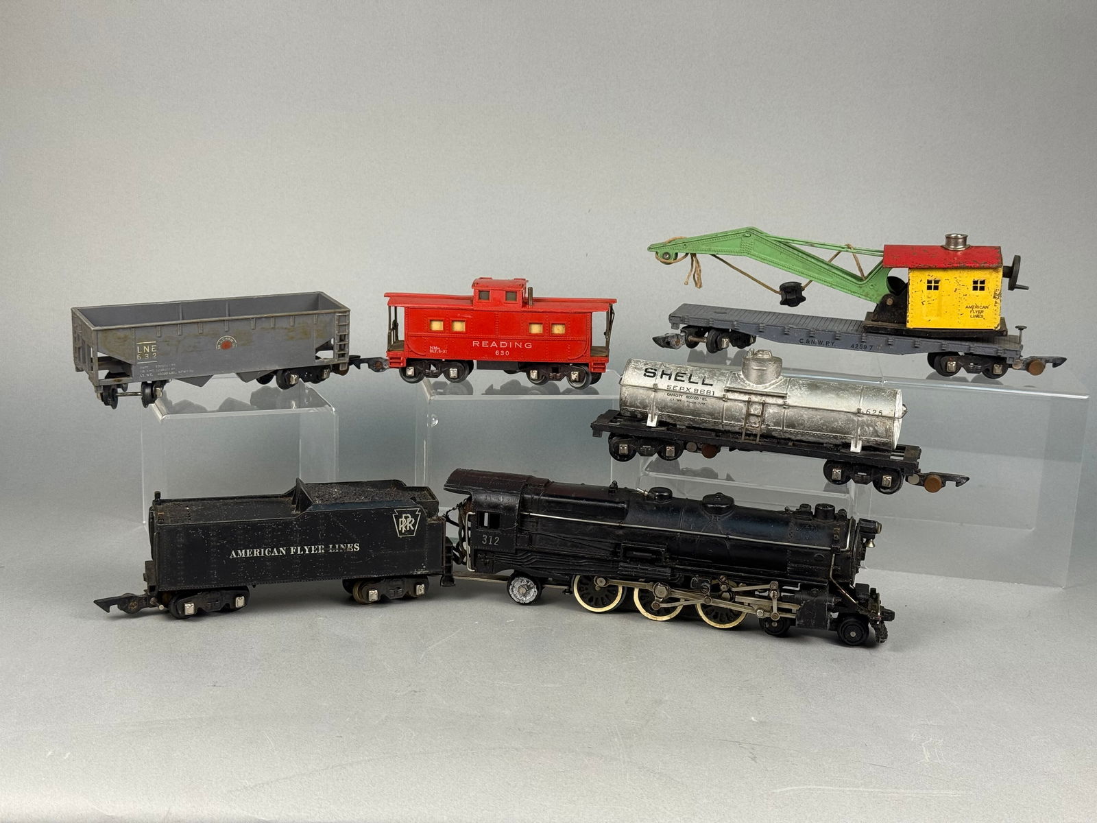 A Group of American Flyer S Gauge Prewar Toy Train Components: A group of American Flyer S Gauge prewar toy train components, manufactured by The A.C. Gilbert Co., New Haven, Conn., U.S.A., predominantly constructed from painted metal. The collection comprises se