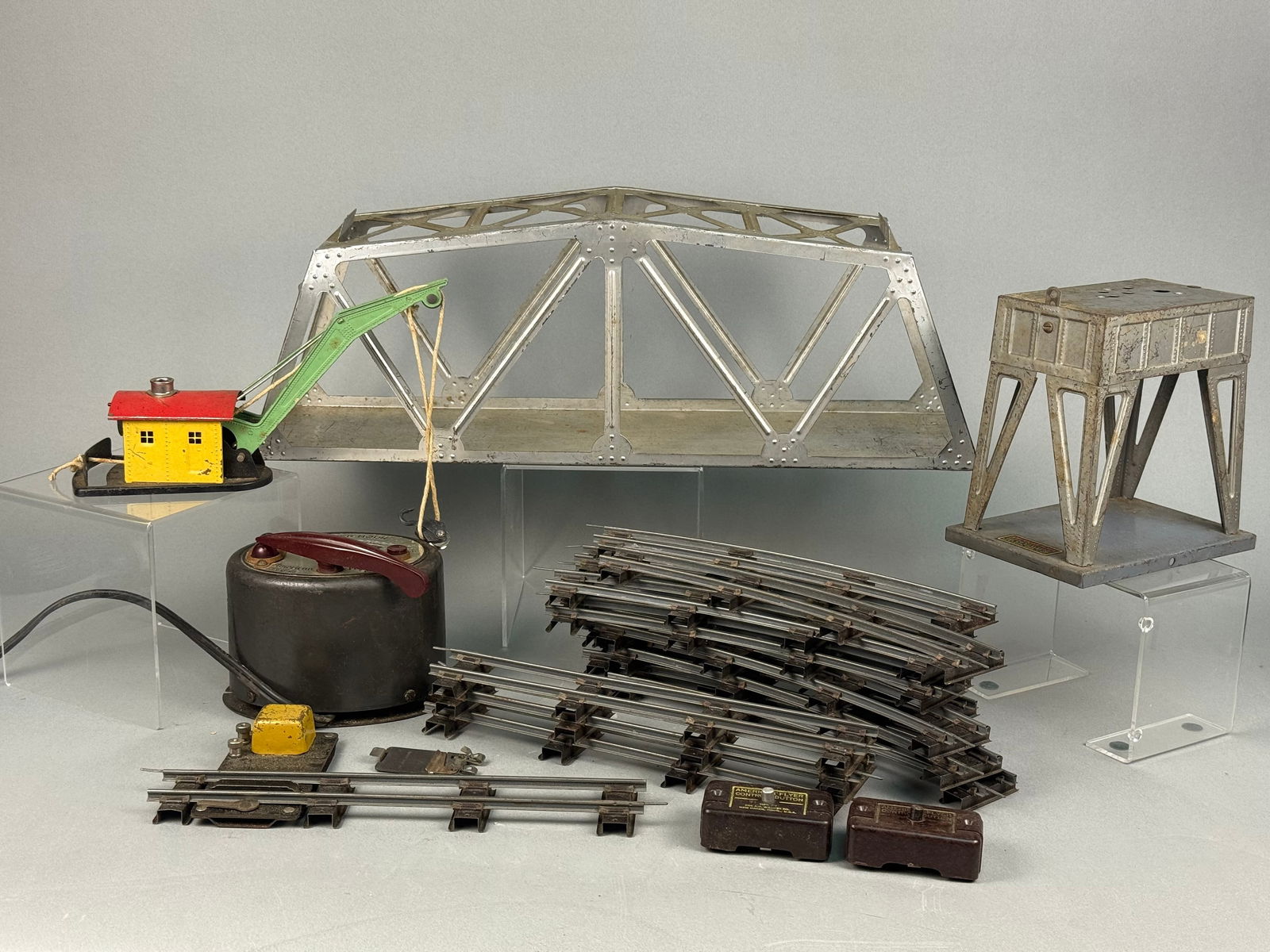 A Collection of Vintage American Flyer Model Train Accessories: A collection of vintage American Flyer model train accessories, manufactured by The A.C. Gilbert Co. of New Haven, Conn., U.S.A., dating to the mid-20th century. The assortment includes a silver-toned