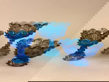 A Set of Three L.E. Smith Blue Moon & Stars Pressed Glass Compotes