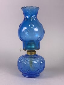 An L.E. Smith 'Moon and Stars' Pattern Blue Pressed Glass Oil Lamp