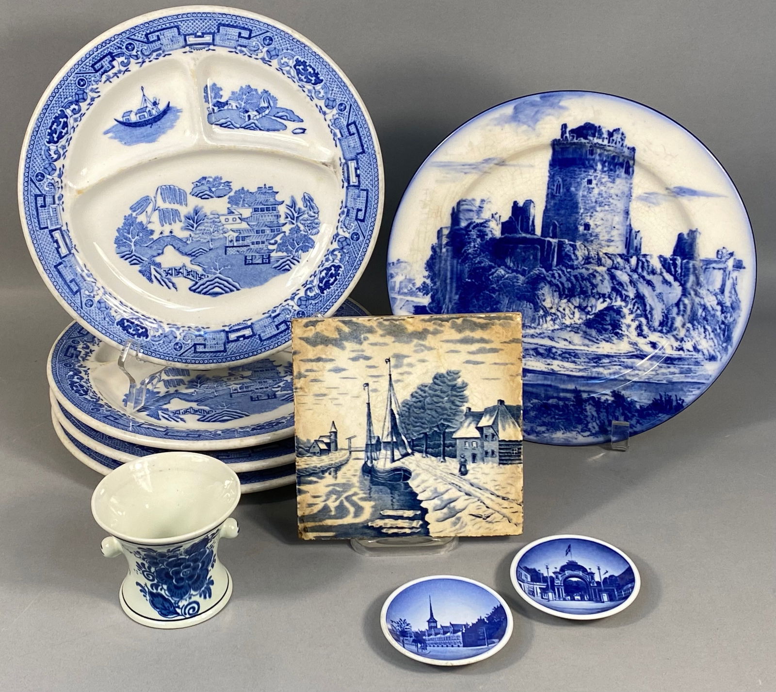 A Royal Doulton 'Pembroke Castle' Flow Blue Plate, a Set of Four Willow Pattern Plates, and a (1 of 18)