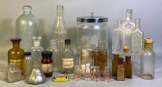 A Collection of Vintage Glass Apothecary and Medicine Bottles, Jars, and a Tin, Late 19th to