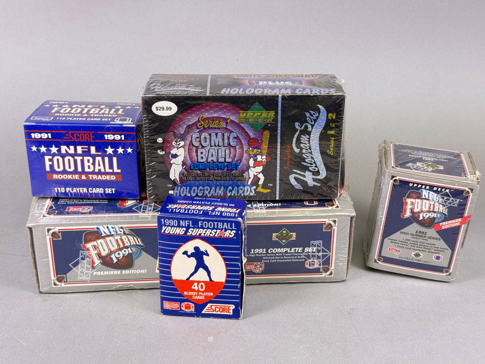 A Collection of Upper Deck Comic Ball Looney Tunes and Vintage NFL Football Trading Card Sets (1 of 2)