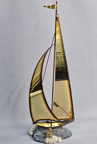 A Mid-20th Century Signed John DeMott Brass Sailboat Sculpture
