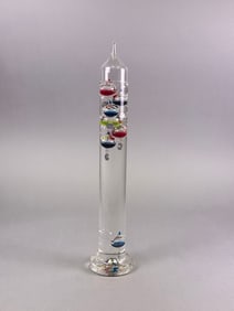 A Tall Glass Galileo Thermometer with Multicolor Floating Bulbs