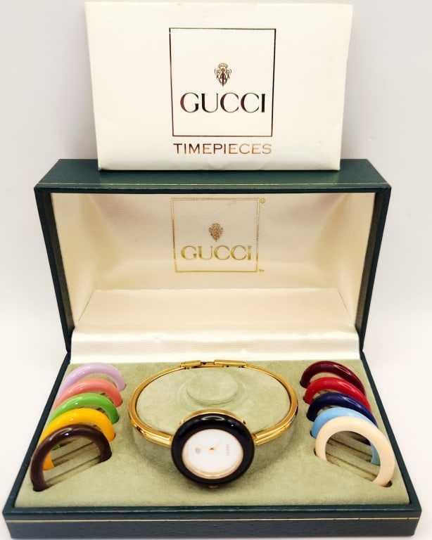Gucci Change Colored Bezel Gold Plated Quartz: Watch Marked #0528156 & 11/12Missing a bezel, only has 11 bezels.Watch is untested.