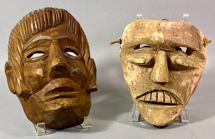 A Pair of Carved Wooden Masks, African and Mexican Style