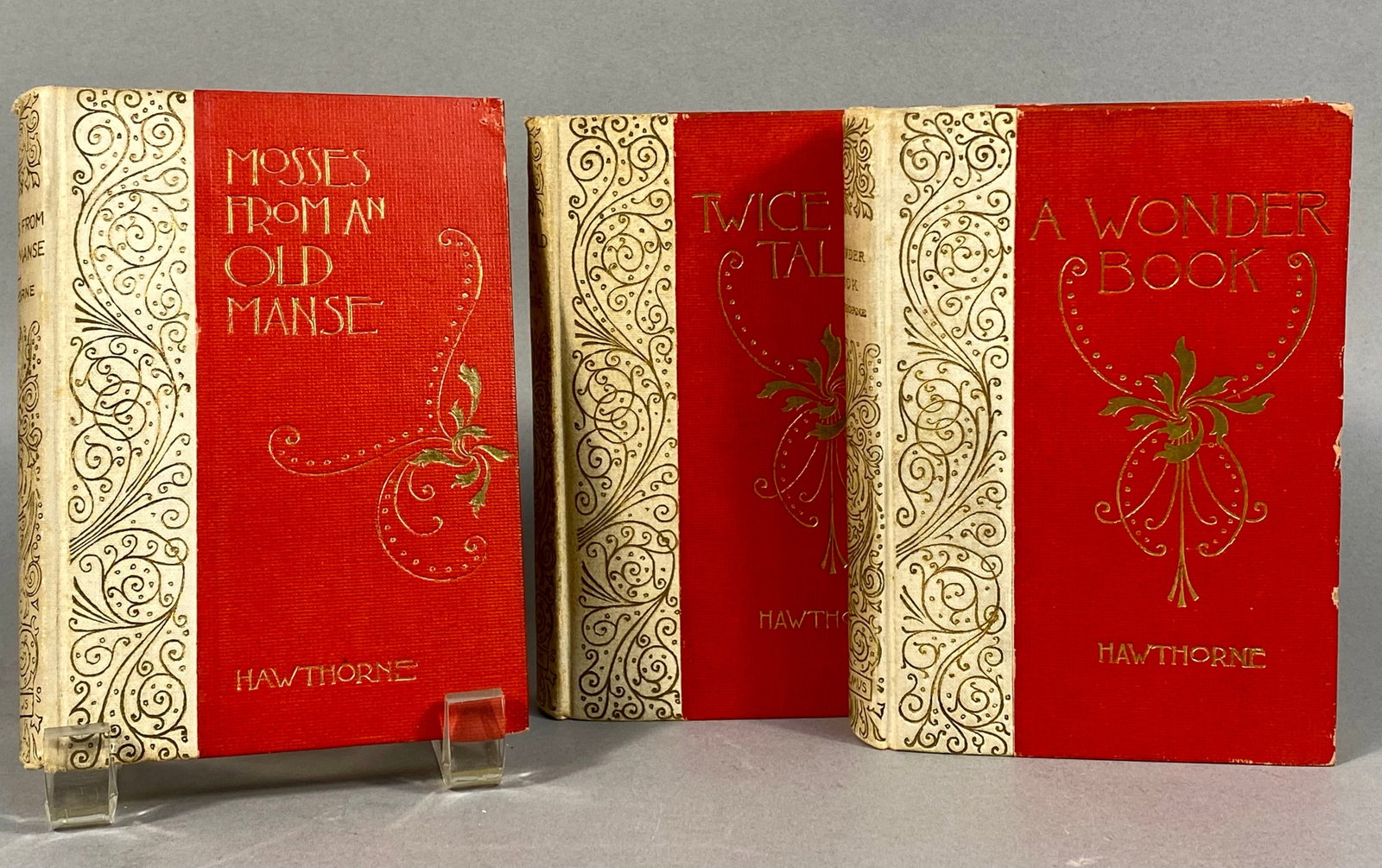 Three Altemus Edition Books by Nathaniel Hawthorne: 'Mosses From An Old Manse', 'Twice-Told Tales',: This lot features three antique cloth-bound books by Nathaniel Hawthorne, published by Henry Altemus of Philadelphia as part of the 'ALTEMUS EDITION'. The titles include 'MOSSES FROM AN OLD MANSE' (da