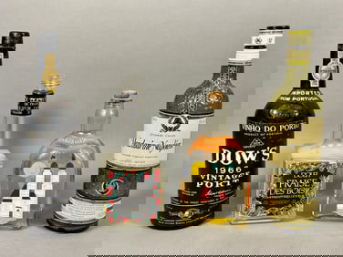 A Collection of Four Vintage Alcoholic Beverage Bottles, including a 1970s Dolfi Fraise des Bois