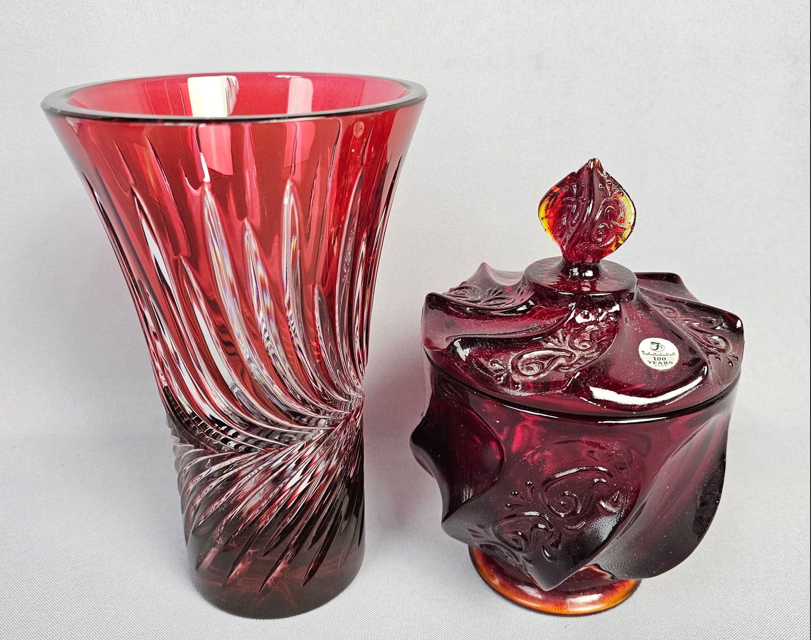 A Pair of Ruby Red Glass Items: A Fenton Lidded Jar and an Art Deco Style Cut-to-Clear Vase (1 of 14)