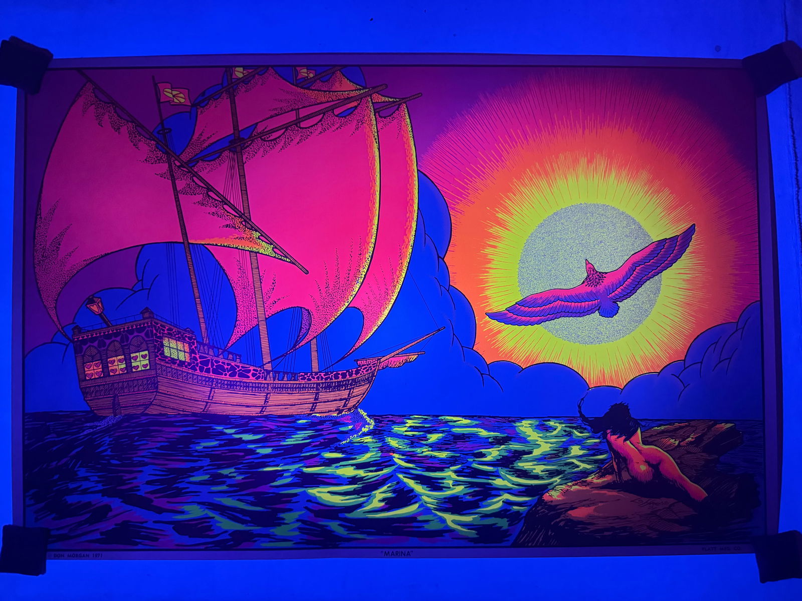 A 1971 'Marina' Psychedelic Black Light Poster by Loffredo, Copyright Don Morgan, Published by Platt: A vintage psychedelic art poster, titled 'Marina', copyrighted by Don Morgan in 1971, published by Platt Mfg. Co., and signed by the artist Loffredo. Printed on paper, the artwork depicts a vibrant ma