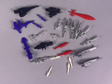 A Collection of G1 Transformers Weapons Parts and Accessories
