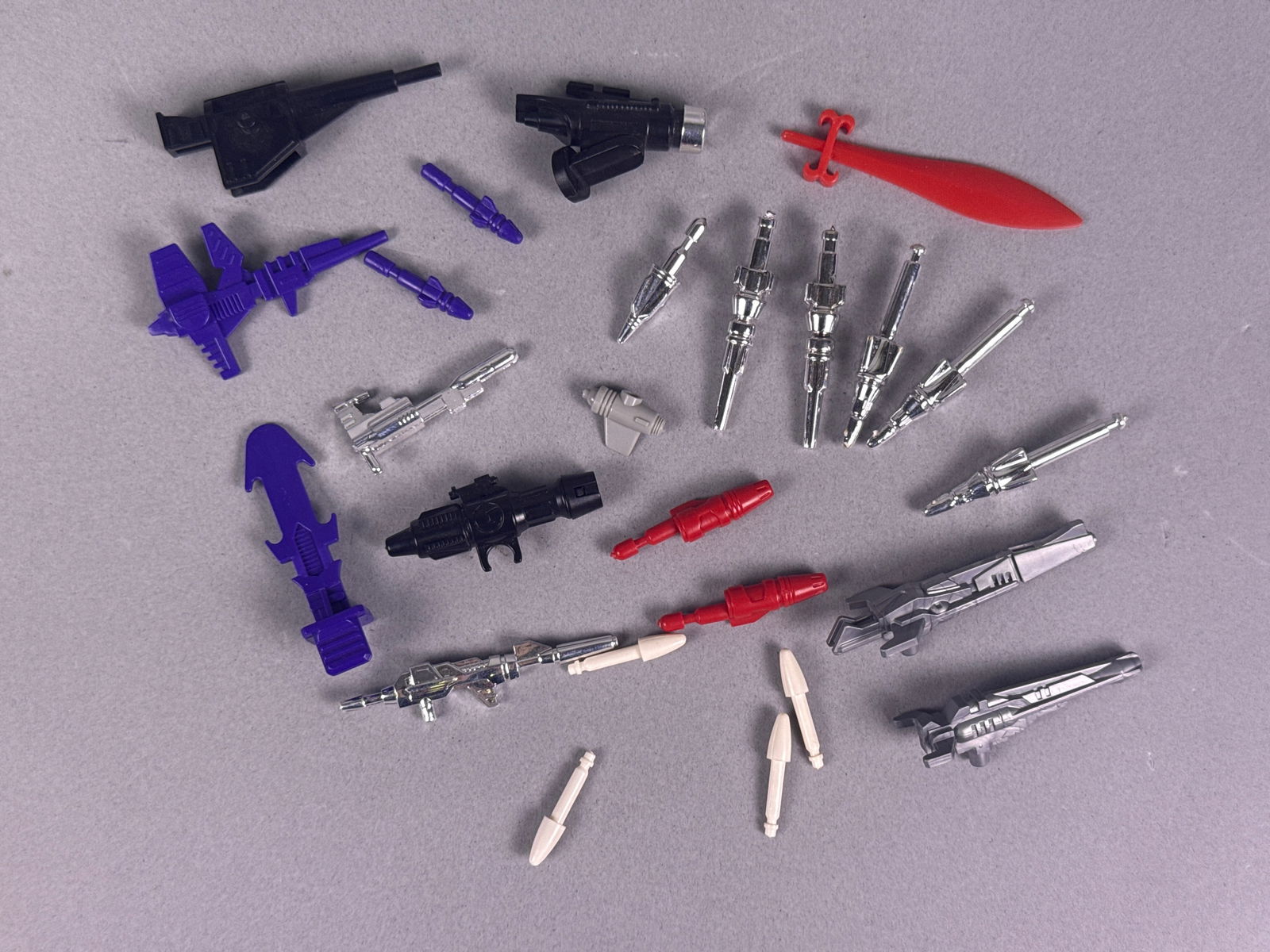 A Collection of G1 Transformers Weapons Parts and Accessories (1 of 5)