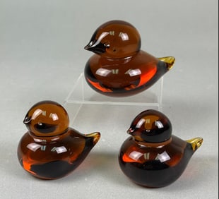 A Set of Three Vintage Amber Glass Bird Paperweights