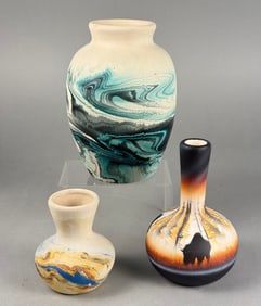 A Collection of Three Assorted Ceramic Art Pottery Vases, including two Nemadji Pottery Swirl Vases