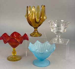 A Viking Honey Amber Six Petal Swung Pedestal Vase and Three Other Glass Compotes