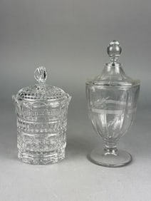 A Pair of Covered Glass Jars, including a Heisey Etched Floral Pedestal Apothecary Jar