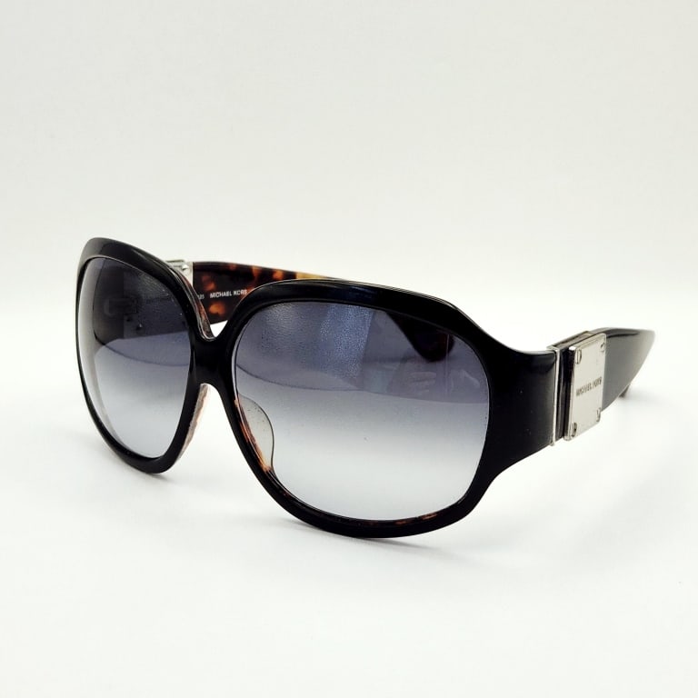 Michael Kors Tortoise Shell Zermatt Sunglasses: #MKS577There is some wear on the inner bridge, see pictures.