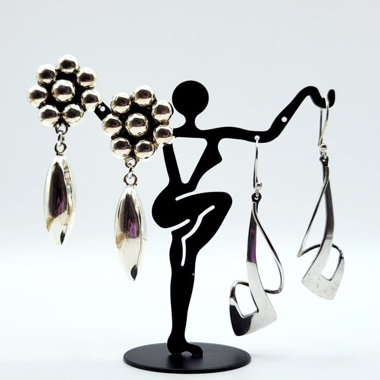 Sterling Silver Earrings 24 Grams: Both pairs of earrings are marked 925.Lot weighs 24 grams.