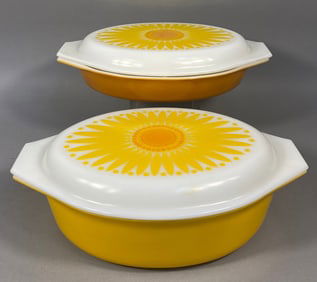 A Pair of Pyrex 'Daisy' Pattern Covered Oval Casserole and Divided Dishes