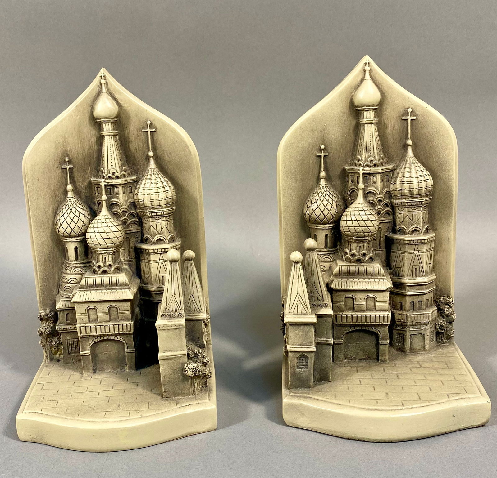 A Pair of TMS Collectibles St. Basil's Cathedral Bookends: A pair of TMS Collectibles St. Basil's Cathedral bookends. Each bookend features a raised architectural relief depicting an iconic Russian Orthodox cathedral, strongly reminiscent of St. Basil's Cathe