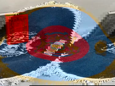 A Group of Three Items: A Michigan Great Seal Rug, Brass Medallion, and a 1997 Edition of 'The