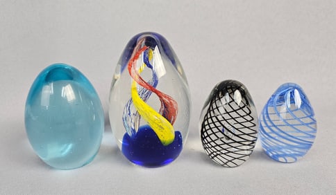 A Collection of Four Contemporary Art Glass Egg Paperweights
