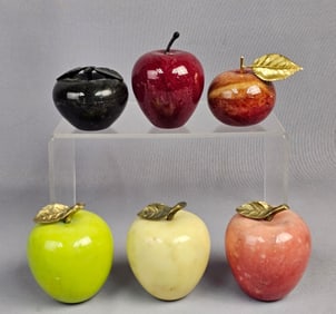 A Collection of Polished Marble Apple Paperweights