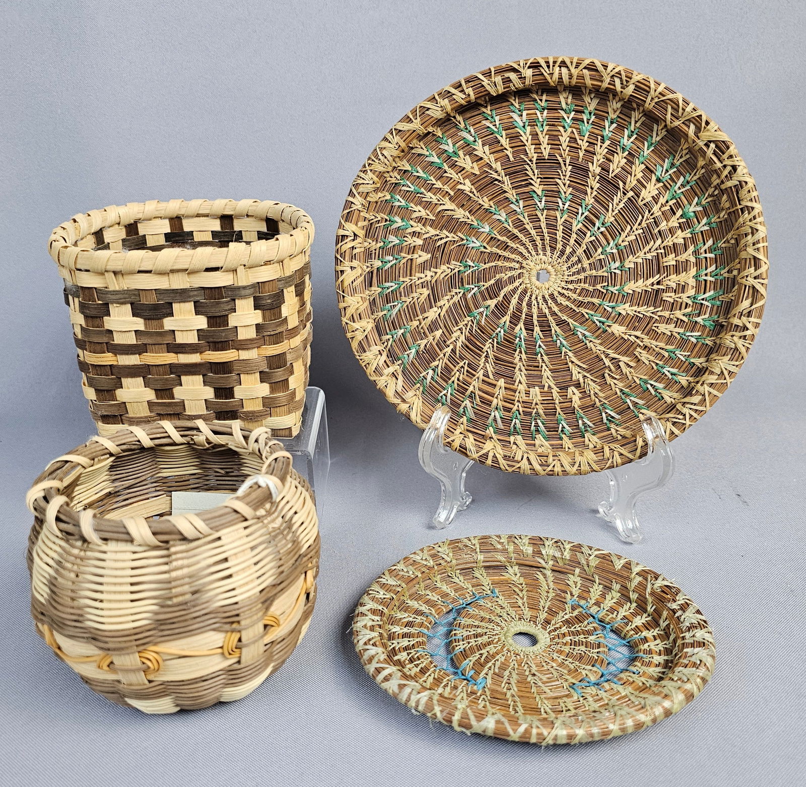 A Group of Four Handcrafted Woven Baskets and Mats, including works by Agnes K. Welch and Pearl (1 of 14)