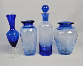 A Collection of Four Cobalt Blue and Light Blue Art Glass Vases and Decanter