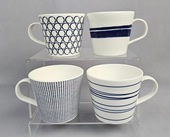 A Set of Four Royal Doulton Pacific Mixed Pattern Mugs