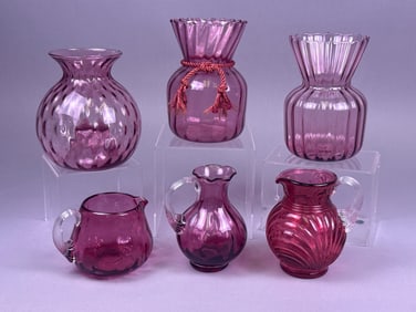 A Collection of Six Pilgrim Cranberry Glass Vessels