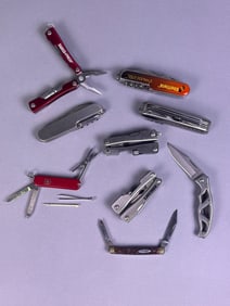 A Collection of Eight Contemporary Folding Knives and Multi-Tools