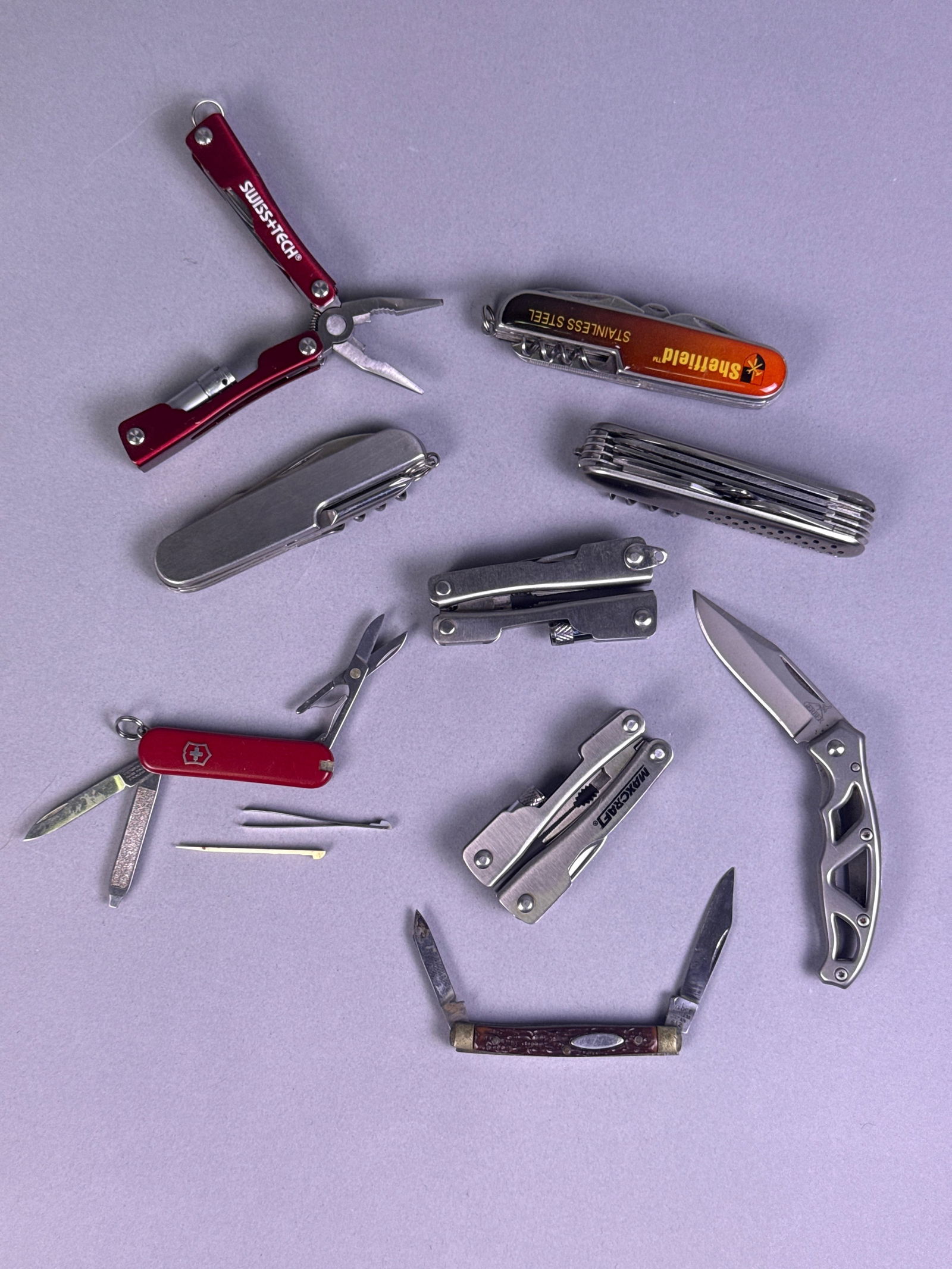 A Collection of Eight Contemporary Folding Knives and Multi-Tools (1 of 6)
