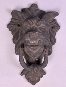 An Antique Cast Iron Lion Head Door Knocker