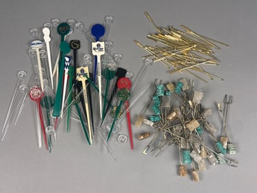 A Collection of Vintage Cocktail Picks, including Stone, Gold-Tone Metal, and Plastic