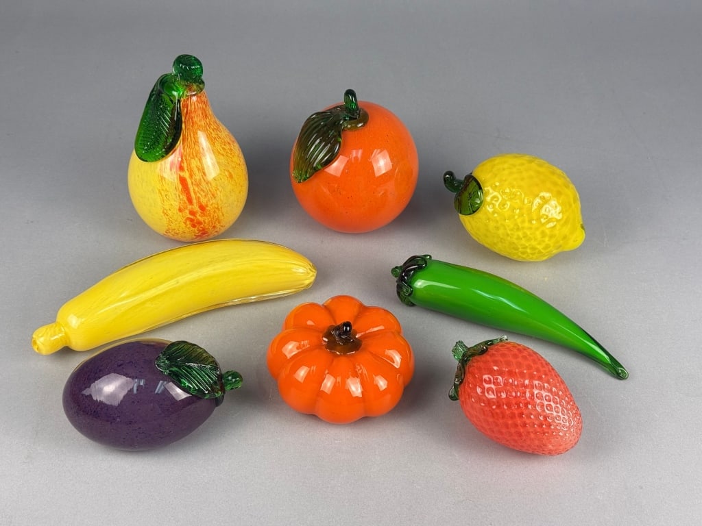 A Set of Eight Mid-Century Murano Style Art Glass: A set of eight Murano Style art glass fruit and vegetable sculptures. Each piece is expertly crafted from brightly colored, blown glass, designed to resemble various fruits and vegetables. The collect