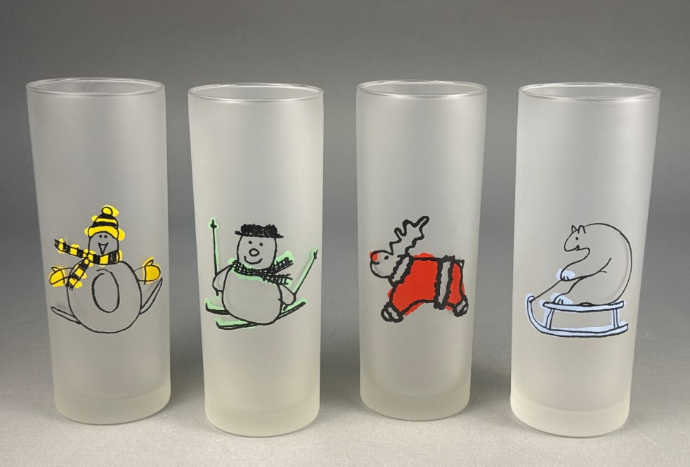 A Set of Four Dartington Designs Frosted Winter Ho: A set of four Dartington Designs frosted glass tumblers, each featuring a whimsical, cartoon-style winter-themed character depicted on its interior surface in black outline with vibrant block colors. 