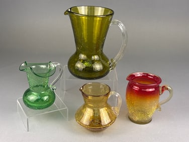 A Collection of Pilgrim Glass Crackle Glass Pitche