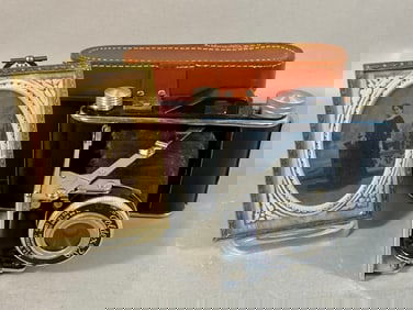 A Foldex 20 Folding Camera with Case and a Victori