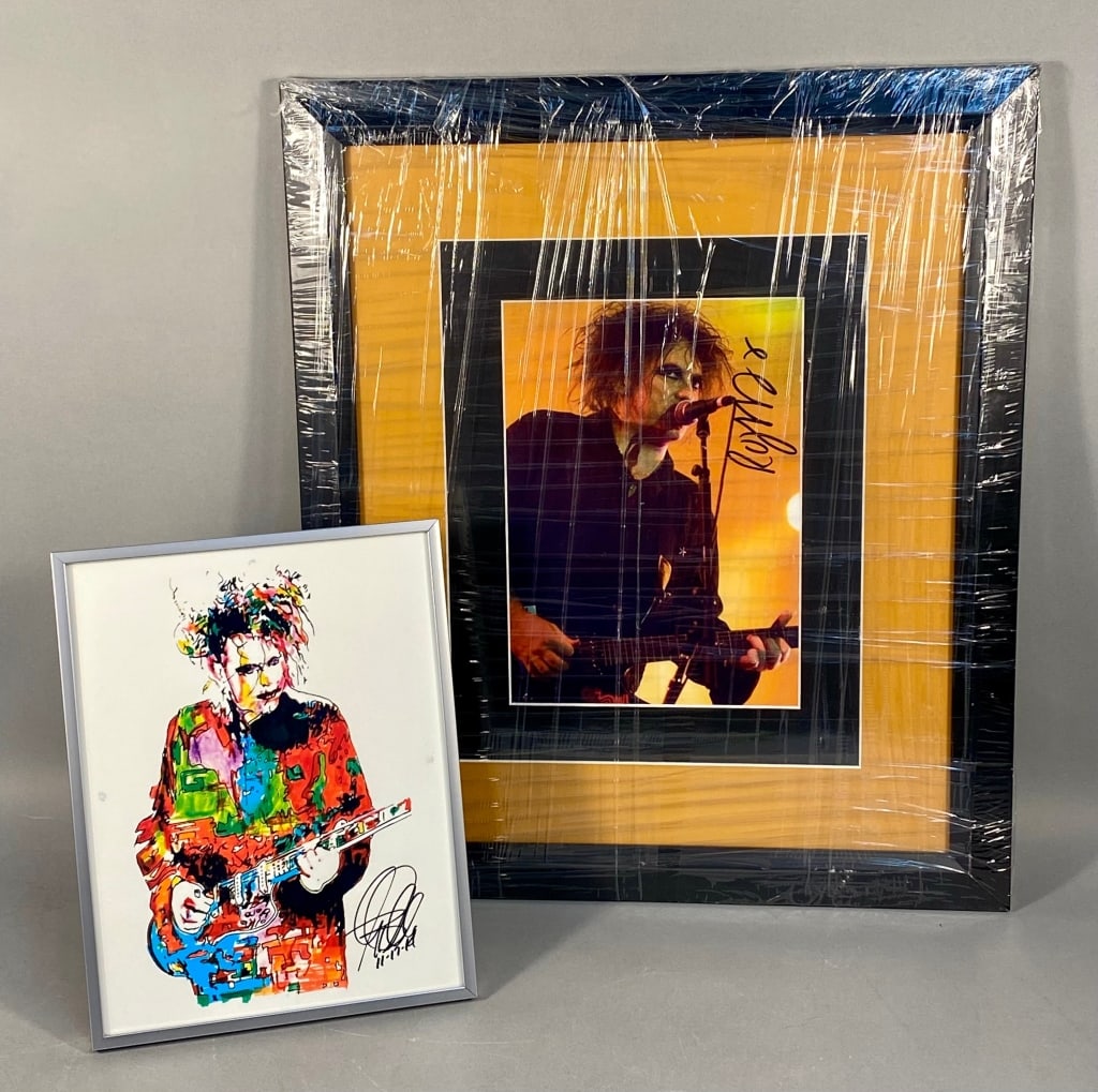 A Pair of Robert Smith (The Cure) Memorabilia: An: This lot comprises two framed memorabilia items featuring musician Robert Smith of The Cure. The larger item is a framed color photograph depicting Smith performing on stage with a microphone and guit
