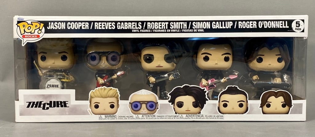 Funko Pop! Rocks: The Cure 5-Pack Vinyl Figure Set: A Funko Pop! Rocks: The Cure 5-Pack vinyl figure set, featuring five stylized vinyl figures depicting band members JASON COOPER, REEVES GABRELS, ROBERT SMITH, SIMON GALLUP, and ROGER O'DONNELL. The fi